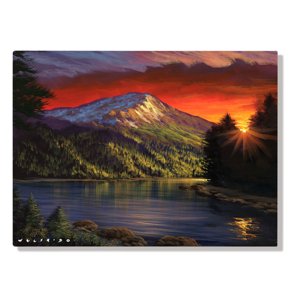 Metal wall art showing the last rays of a crimson sunset reflecting off the glass-like surface of a remote Alaskan lake, emerging from behind a lone pine tree on the bank by Hawaii artist Walfrido Garcia.