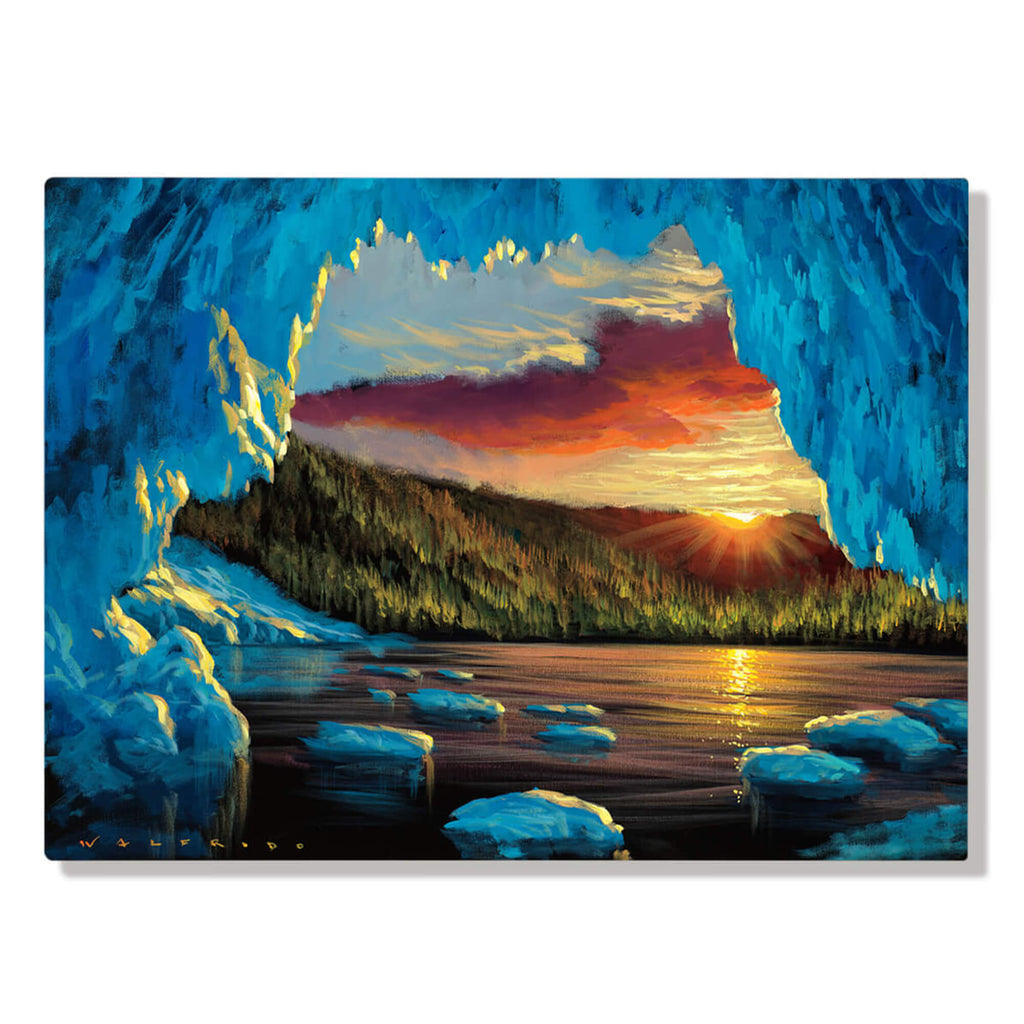 Metal art print showing the perspective looking outwards from inside a blue icy cavern towards a lake at dusk, framed by verdant trees and backlit mountains by Hawaii artist Walfrido Garcia.