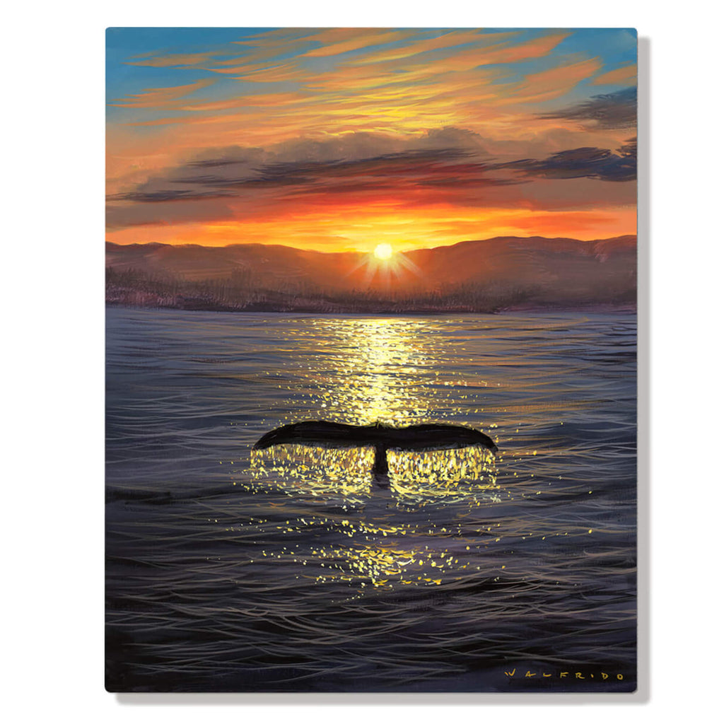 A humpback whale's tail fin emerges from a tranquil lake at sunset, with bright oranges and yellows reflecting on the still water by Hawaii artist Walfrido Garcia.