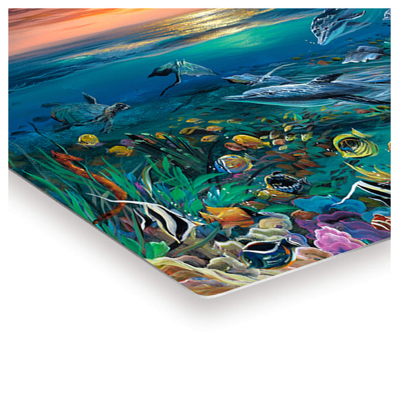 A metal art print featuring colorful sea creatures and a beautiful sunset by Hawaii artist Walfrido Garcia