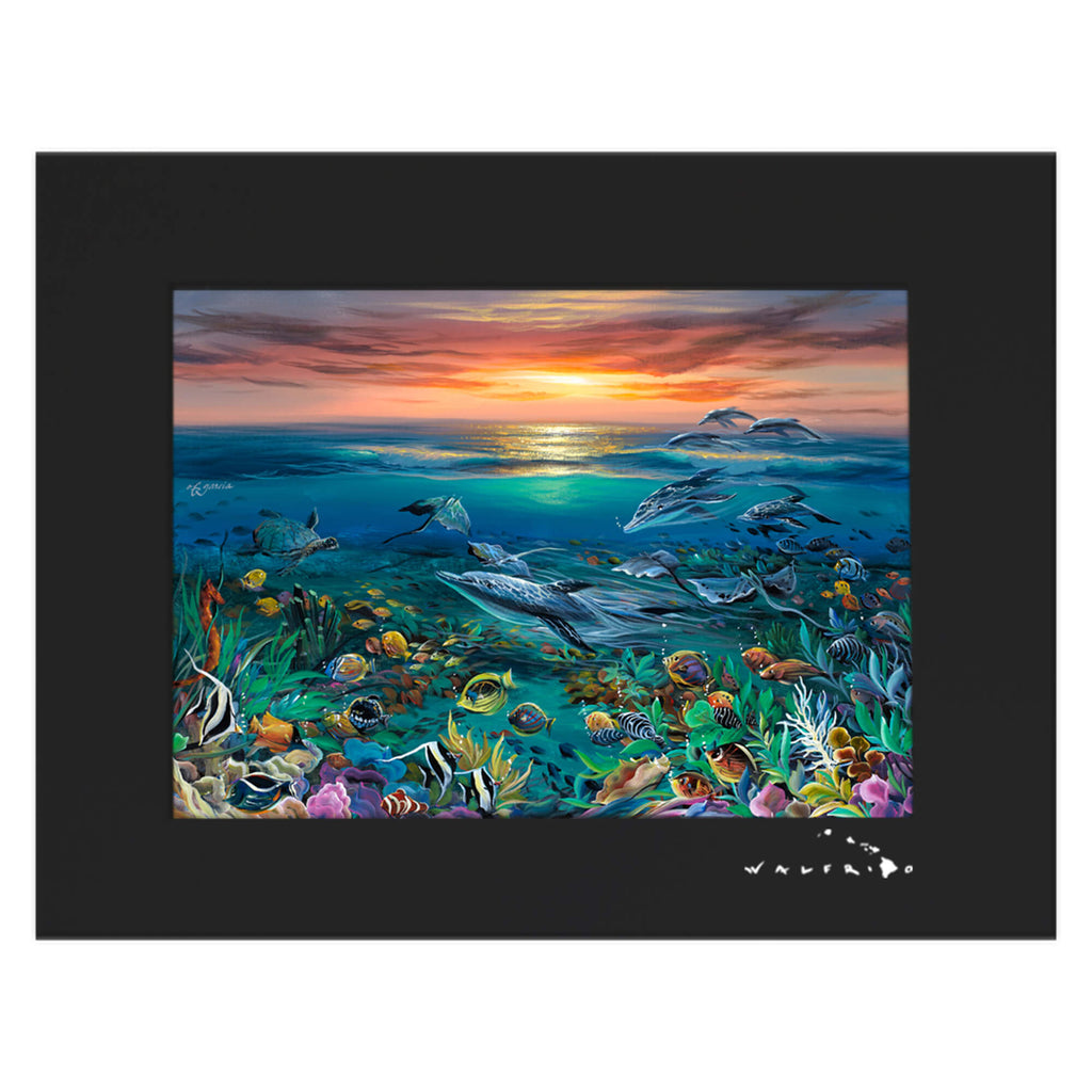 A matted art print featuring colorful sea creatures and a beautiful sunset by Hawaii artist Walfrido Garcia